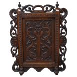 An Antique Carolean style carved oak panel, H77cm