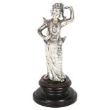 A late 19th century? Burmese white metal figure, study of a deity on turned wood plinth, H17cm