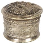 An Oriental white metal circular box and cover, with allover embossed decoration, W7.5cm Good