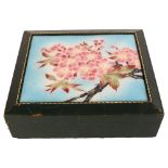 A green leather-bound jewel box, with floral enamel inset panel, 22cm x 19cm Leather is worn at