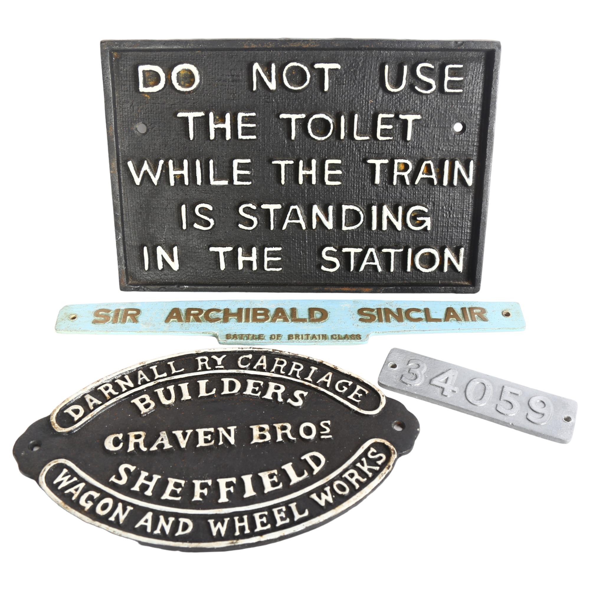 A group of modern railway-related signs, including a cast-iron sign with narrative "Do not use the