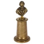 A cast-brass military bust of Henri IV, surmounted on a turned brass column, H18.5cm