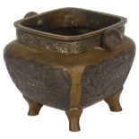 A Chinese bronze censer, with relief carved panels and seal mark to the base, H8cm Good overall