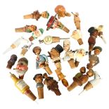 A collection of Vintage novelty bottle stoppers/pourers