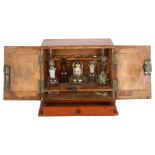 An Antique mahogany Apothecary cabinet, 2 doors opening to reveal a bottle-fitted interior (