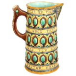 A Victorian Wedgwood Majolica "Caterer" jug, with verse "What tho my cates be poor, take them in