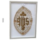 A framed religious gilded fabric panel, 64 x 47cm overall