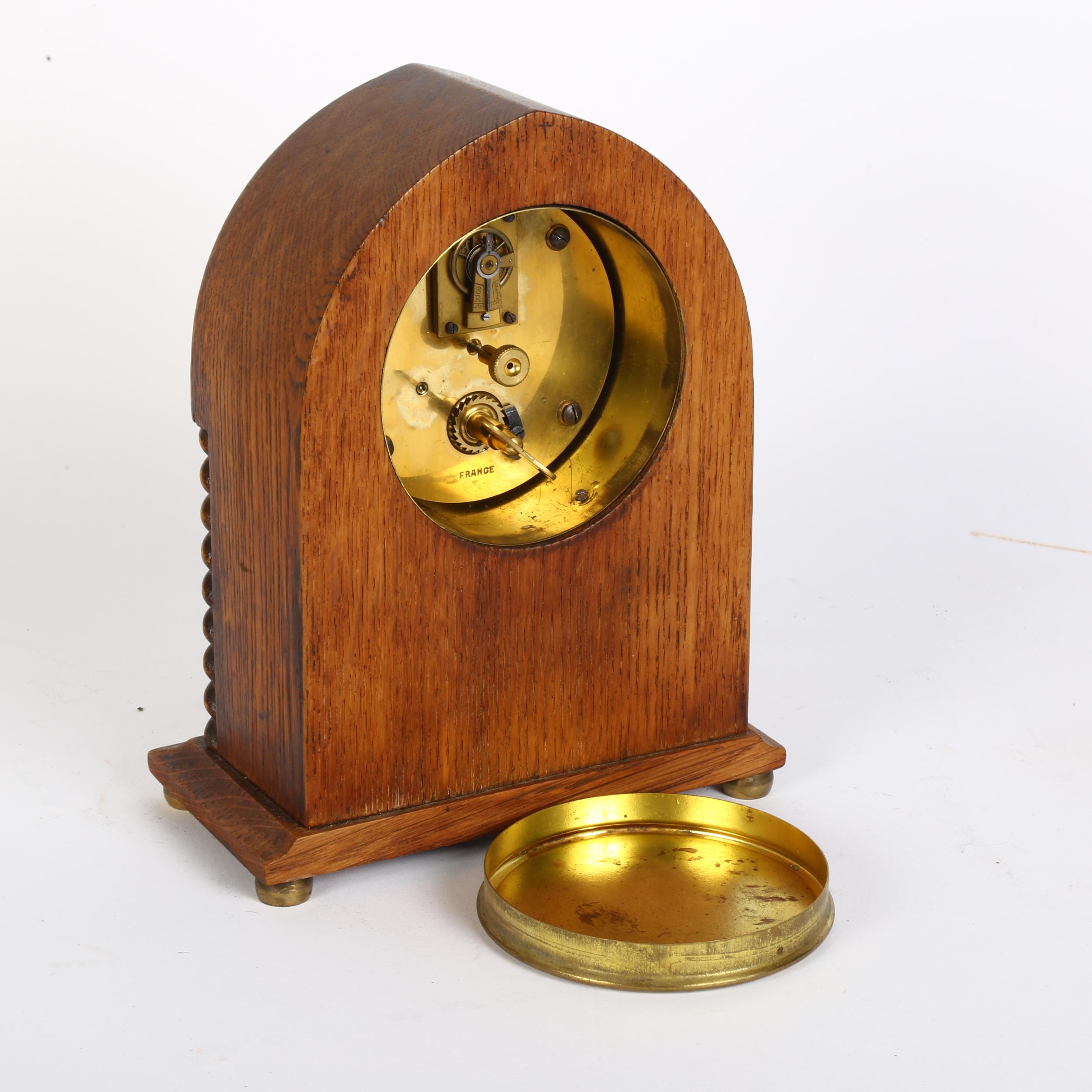 An Edwardian oak lancet-top mantel clock, with French movement and enamel dial, H20cm Good overall - Image 2 of 2