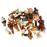 A large quantity of novelty bottle stoppers, including Father Christmas, a Kinkibee character etc