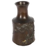 A Japanese bronze vase with relief tree and gilt decoration in mallet form, height 15cm Drilled to