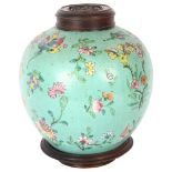 An Antique Chinese jar with carved wood cover and stand, overall height 25cm Chips to inside of rim,