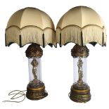 A pair of American gilded spelter and crackle glazed table lamps, with domed tasselled shades,