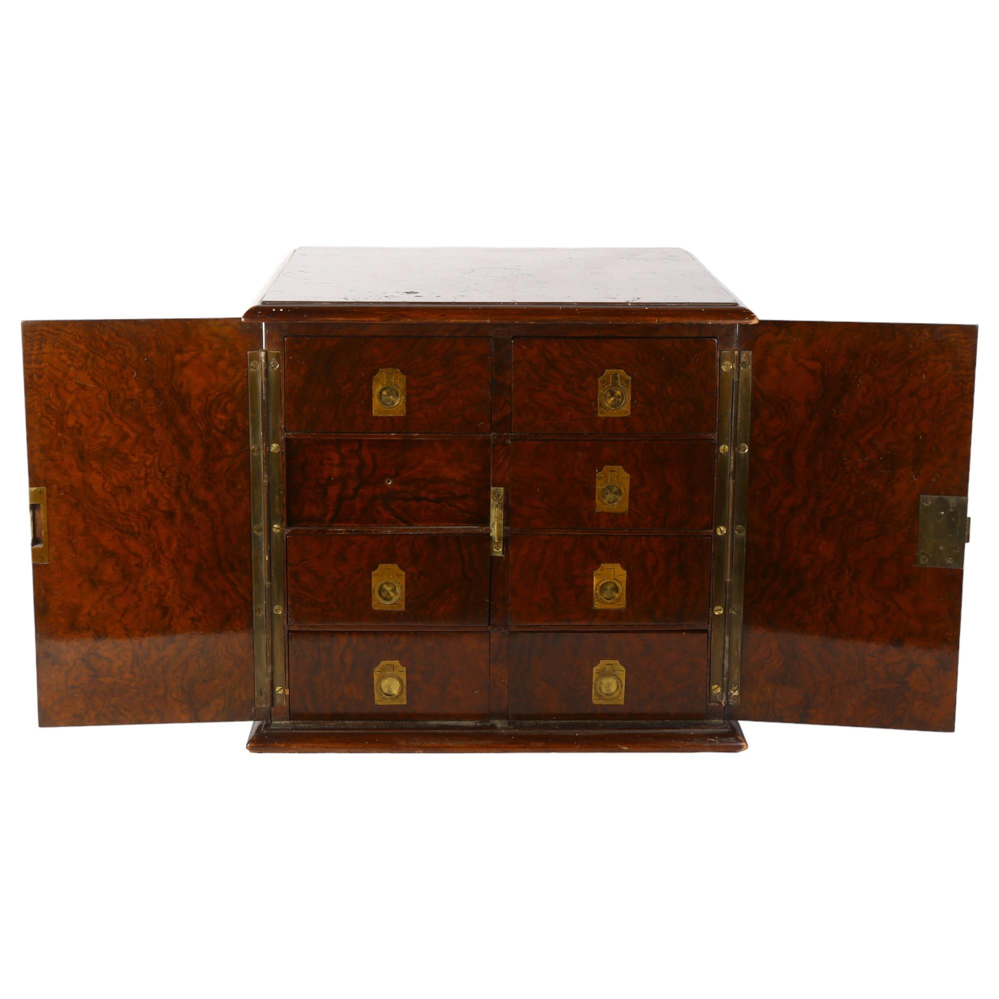 A Victorian burr-walnut table-top collector's cabinet, the 2 doors opening to reveal 8 short