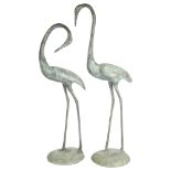A pair of verdigris metal garden crane bird figures, tallest 60cm