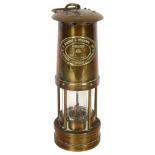 E THOMAS & WILLIAMS LTD, OF CAMBRIAN - a brass miner's lamp, no. 57520, H25cm