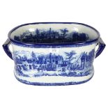 A reproduction ceramic 2-handled foot bath with blue and white printed decoration, overall length