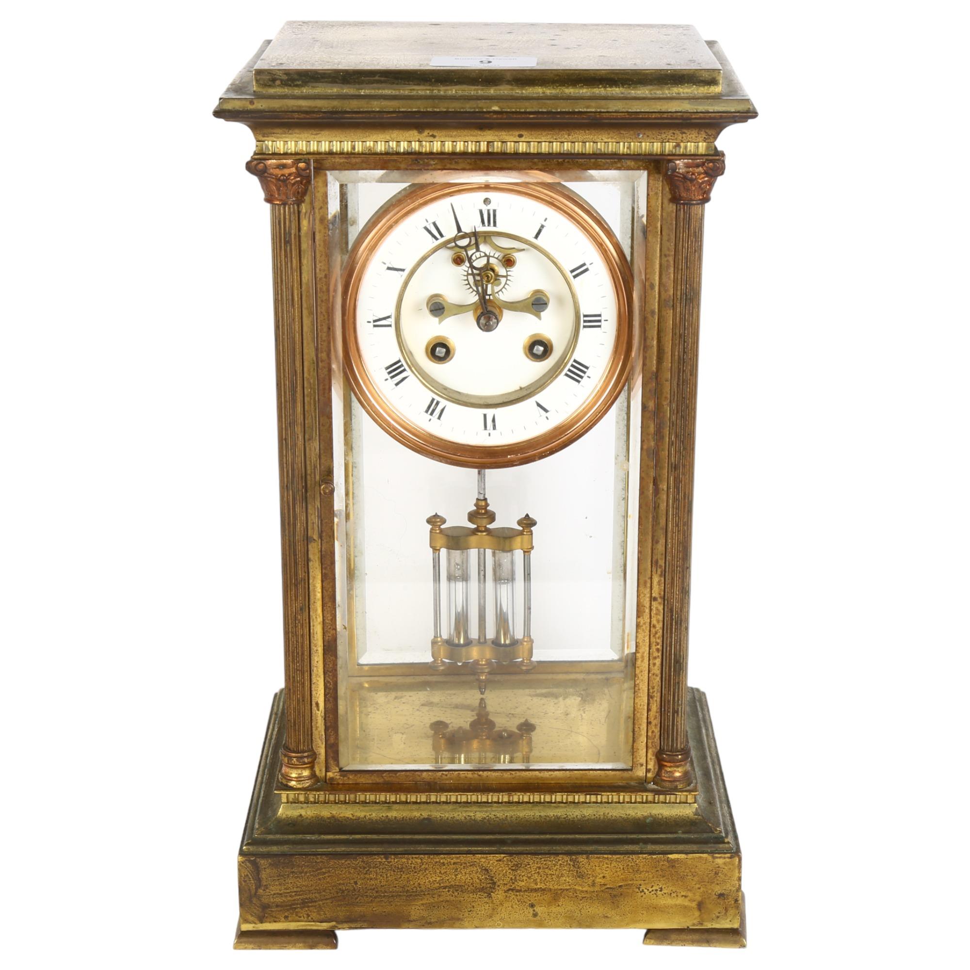 A brass-cased 8-day 4-glass mantel clock, with white enamel dial, Roman numerals, and open