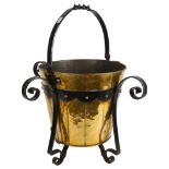 An Arts and Crafts brass and wrought-iron bucket, H55cm