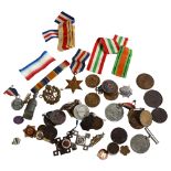 A Second World War medal and ribbons, various badges, sporting medallions etc