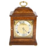 An Elliott walnut-cased 8-day mantel clock, with a French escapement, retailed by Rix of Hastings,