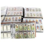 A quantity of complete sets of sports-related cigarette cards in 5 display albums, sets include