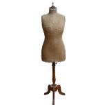 An Antique French Stockman mannequin, on turned wood tripod stand, overall height 157cm