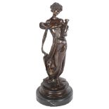 After Jean Patoue, patinated bronze sculpture, figure holding a vase, on turned marble base, H35cm