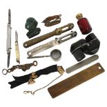 A group of interesting items, including a small carved green stone owl, 2 wristwatch tools,