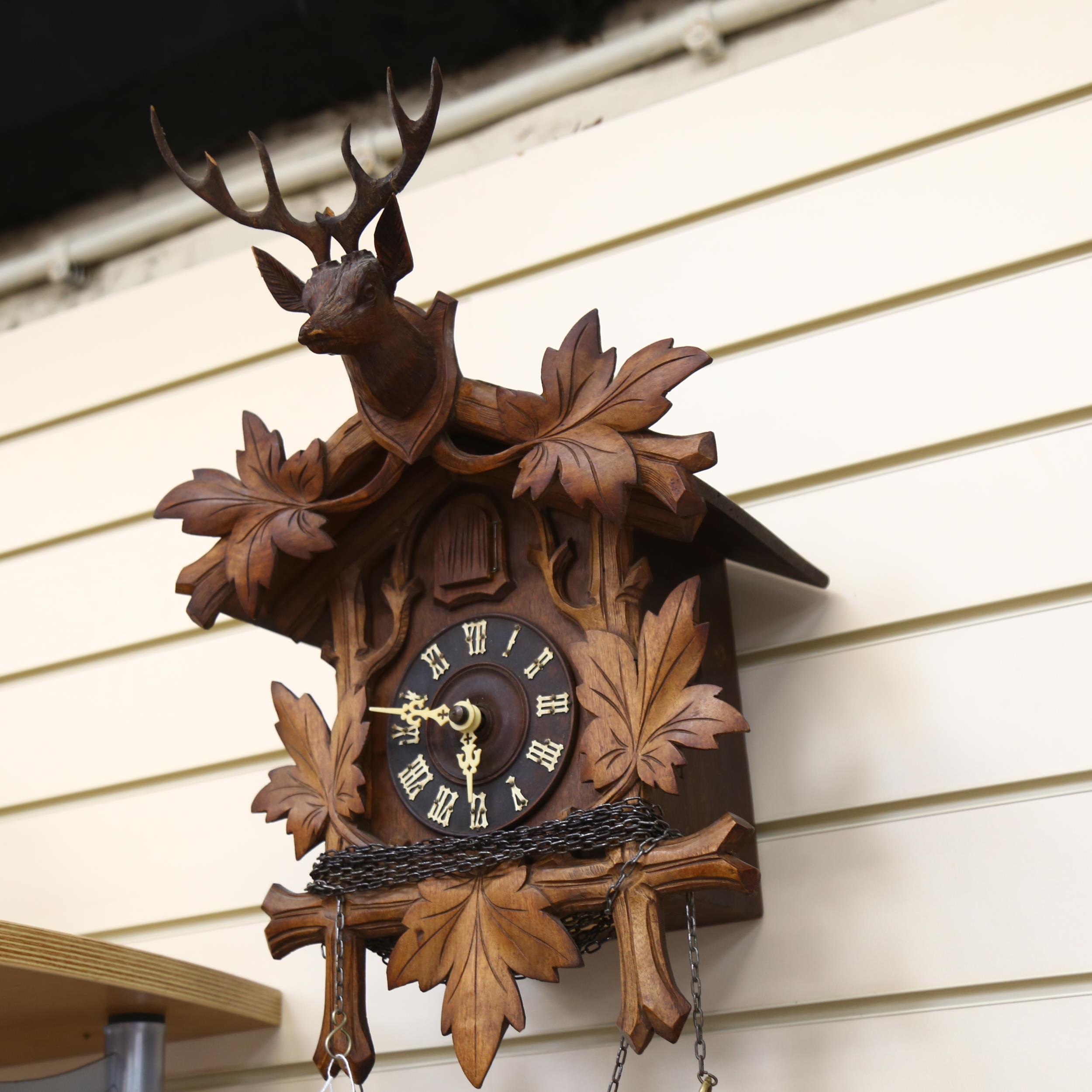 A Black Forest carved cased cuckoo clock, complete with cone weights and pendulum, clock height 50cm - Bild 2 aus 2