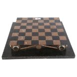 A painted metal chessboard on scrolled frame and marble base, overall width 38cm