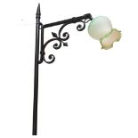 A wrought-iron standard lamp, with adjustable shade, H160cm