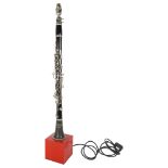 A Corton Czechoslovakian clarinet that has been converted into a lamp, on a modern wooden base,