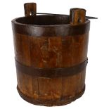 A wooden metal-bound well bucket, height to rim of bucket 33cm