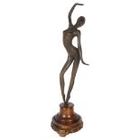 A patinated spelter study of a female dancer, on turned wood stand, overall height 47cm
