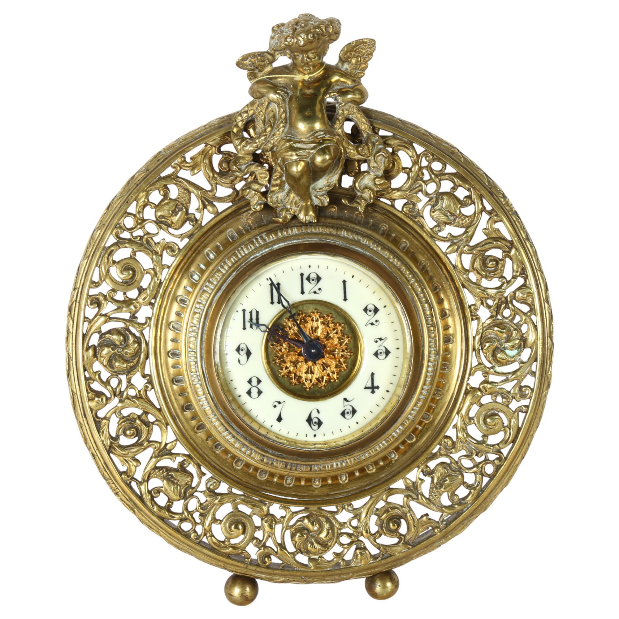 A gilt-bronze 8-day mantel clock, with mounted cherub decoration, and floral decorative surround,