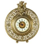 A gilt-bronze 8-day mantel clock, with mounted cherub decoration, and floral decorative surround,