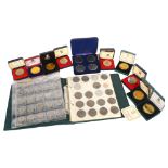 Various Silver Jubilee and Coronation collector's coins, cased, and an album of pre-decimal