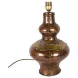 A studded brass and copper table lamp, impressed to the base F D H