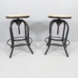 A pair of modern industrial style stools with rise and fall mechanism. Height (lowest) 69cm