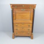 An antique French oak Secretaire, the fall front revealing a fitted interior, and four long drawers.
