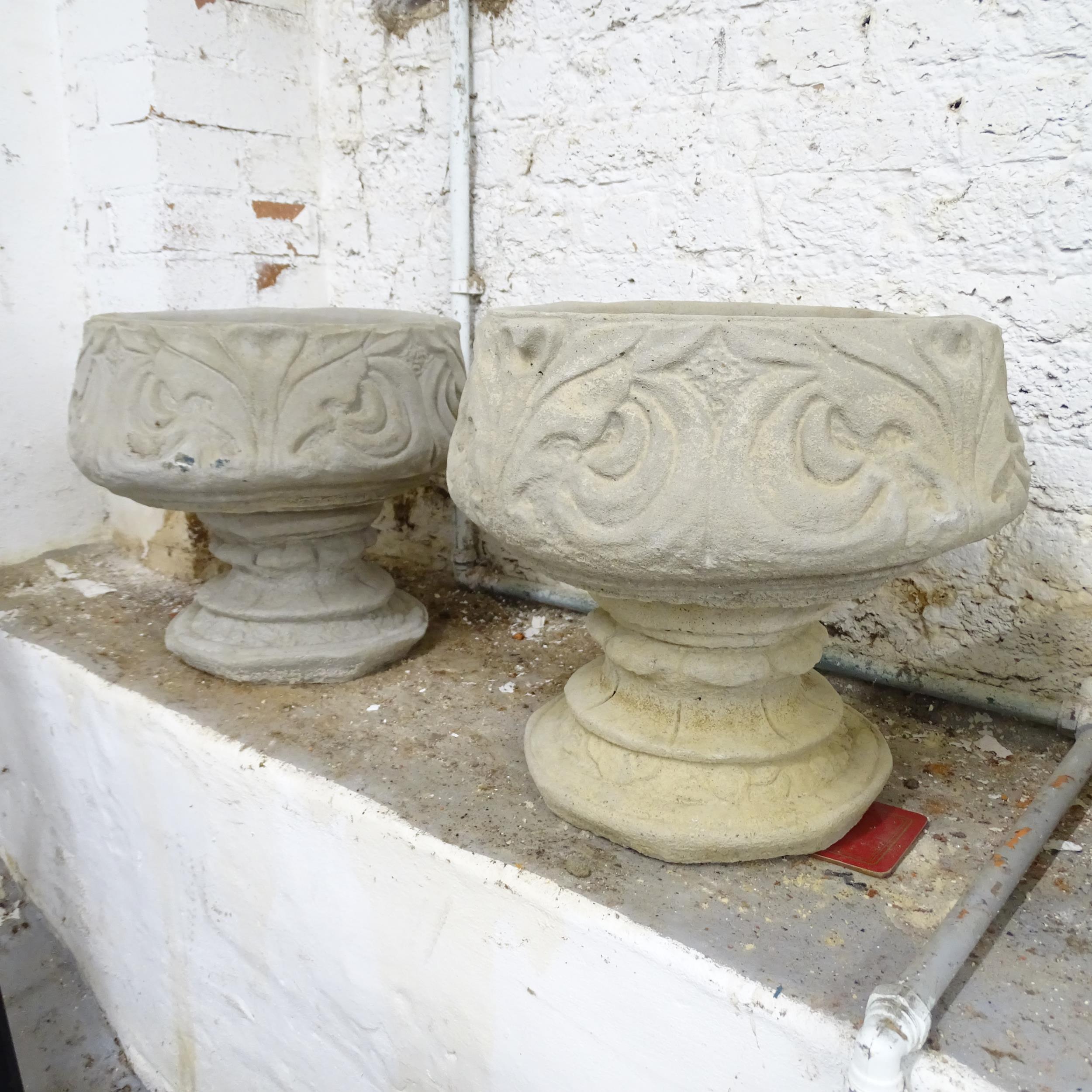 A pair of two-section circular concrete garden urns. 40x40cm