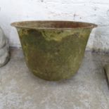 A weathered metal circular garden planter with rounded base. 48x39cm