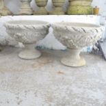 A pair of two-section concrete urns. 54x42cm