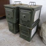 Four vintage metal ammunition boxes.