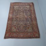 A red-ground Keshan rug. 220x136cm.