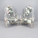 A pair of mid-century French wrought-iron conservatory chairs, with scrolled arms, in the manner