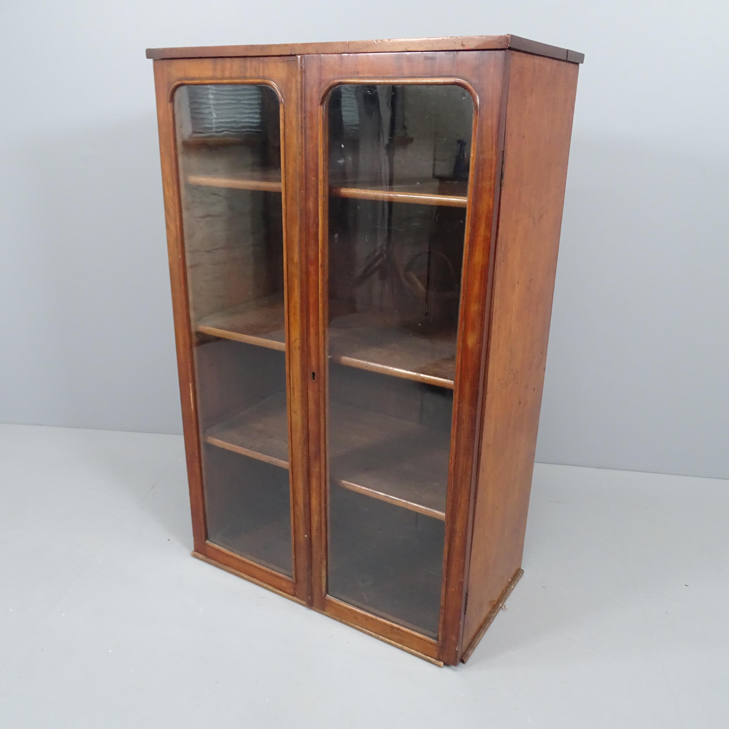 A Victorian mahogany 2 door bookcase with 3 adjustable shelves. 70x106x36cm. Most likely the