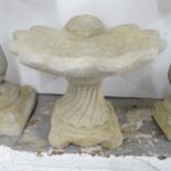 A two-section concrete shell design bird bath. 51x43cm