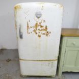 A mid-century General Electric Company (G.E.C) white enamelled fridge, with interior fittings and