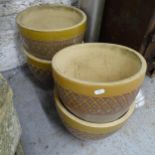 A set of four glazed ceramic garden planters. 30x24